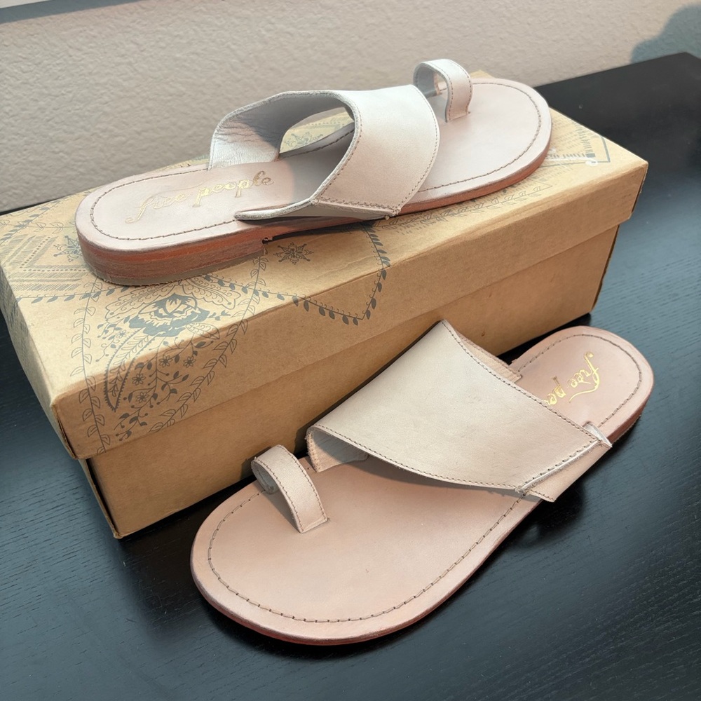 Free People Sant Antoni Slide in a natural leather color.